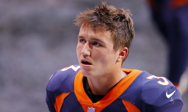 Drew Lock #3 of the Denver Broncos reacts after being defeated by the Atlanta Falcons 34-27 at Merc...