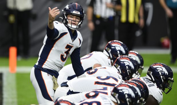 LAS VEGAS, NEVADA - NOVEMBER 15: Quarterback Drew Lock #3 of the Denver Broncos signals during the ...