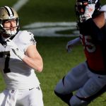 DENVER, COLORADO - NOVEMBER 29: Taysom Hill #7 of the New Orleans Saints looks to pass during the first quarter of a game against the Denver Broncos at Empower Field At Mile High on November 29, 2020 in Denver, Colorado. (Photo by Matthew Stockman/Getty Images)