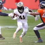 DENVER, COLORADO - NOVEMBER 29: Alvin Kamara #41 of the New Orleans Saints rushes against Josey Jewell #47 and Bradley Chubb #55 of the Denver Broncos during the second quarter of a game at Empower Field At Mile High on November 29, 2020 in Denver, Colorado. (Photo by Matthew Stockman/Getty Images)