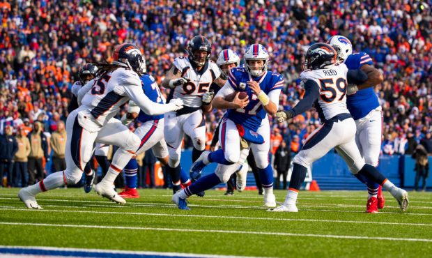 ORCHARD PARK, NY - NOVEMBER 24: Josh Allen #17 of the Buffalo Bills runs with the ball in the red z...