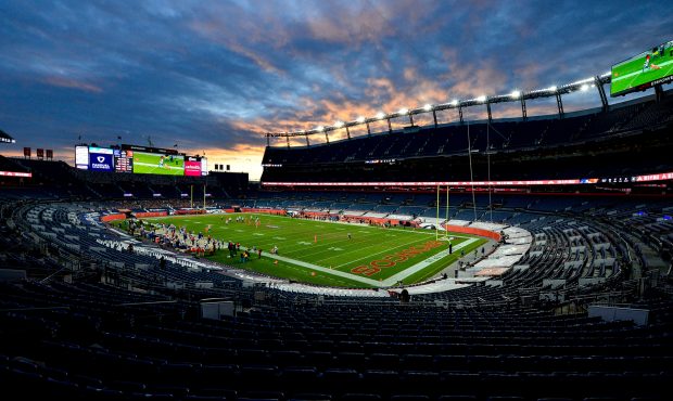 DENVER, CO - DECEMBER 19: A general view of a stadium devoid of any fans as the sun sets during a g...