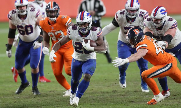 DENVER, COLORADO - DECEMBER 19: Zack Moss #20 of the Buffalo Bills rushes the ball during the fourt...