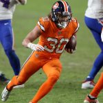 DENVER, COLORADO - DECEMBER 19: Phillip Lindsay #30 of the Denver Broncos rushes the ball during the fourth quarter against the Buffalo Bills at Empower Field At Mile High on December 19, 2020 in Denver, Colorado. (Photo by Matthew Stockman/Getty Images)