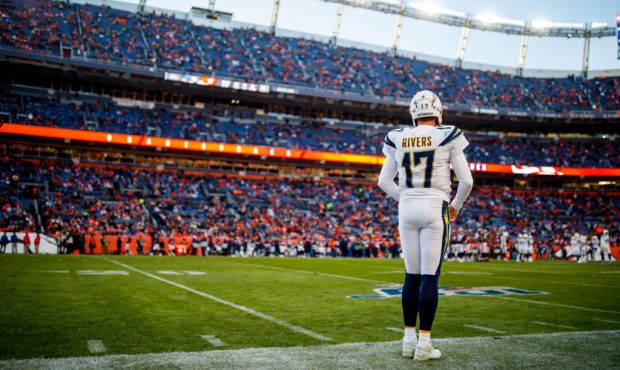 DENVER, CO - DECEMBER 01: Quarterback Philip Rivers #17 of the Los Angeles Chargers stands on the s...