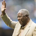 Hall of famer Hank Aaron waves to the crowd before the start of the Washington Nationals game at Miller Park on August 2, 2013 in Milwaukee, Wisconsin.  Aaron was on hand to commemorate Robin Yount on his 20th anniversary of retirement.  (Photo by Tom Lynn/Getty Images)