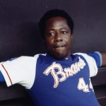 Outfielder Hank Aaron #44 of the Atlanta Braves relaxes in the dugout during a circa 1970s game. 