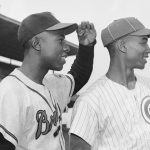 Hank Aaron of the Braves (l) and Ernie Banks of the Cubs look out to right field in Wrigley Field here where Banks clouts most of his homers. Banks is credited with 42 homers this season, one more than Aaron, to lead the National League.