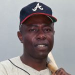Hank Aaron is shown in this close up. He is shown as an Atlanta Braves outfielder during Spring Training.