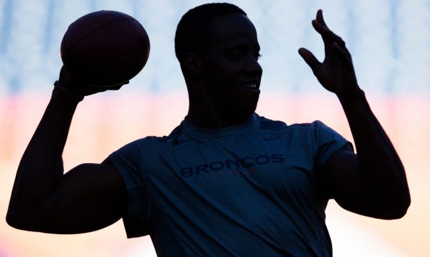 DENVER, CO - AUGUST 11: Silhouette of a Denver Broncos player while warming up before a game agains...