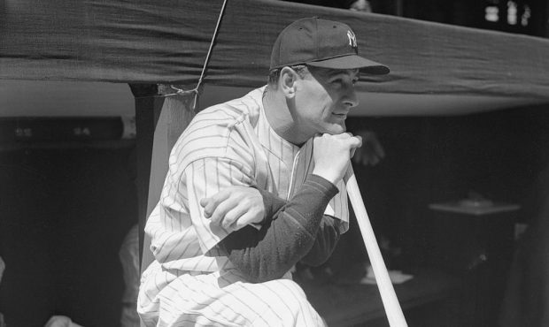 Lou Gehrig Leaning on Baseball Bat While Watching Game from Dugout...