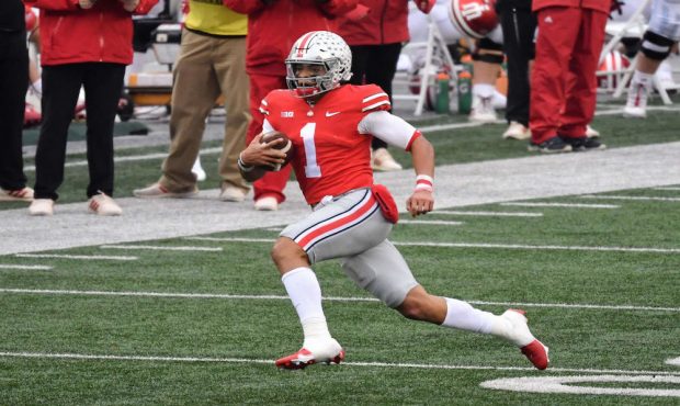COLUMBUS, OH - NOVEMBER 21:  Quarterback Justin Fields #1 of the Ohio State Buckeyes carries the ba...