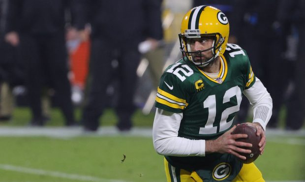 GREEN BAY, WISCONSIN - DECEMBER 19: Aaron Rodgers #12 of the Green Bay Packers looks to pass during...