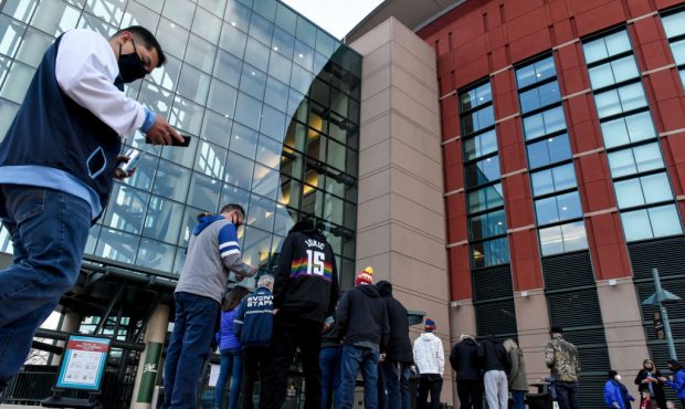 DENVER, CO - MARCH 30: Fans arrive for the first time this season in person as the Denver Nuggets t...