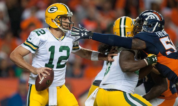 DENVER, CO - NOVEMBER 1: Quarterback Aaron Rodgers #12 of the Green Bay Packers looks for an open r...