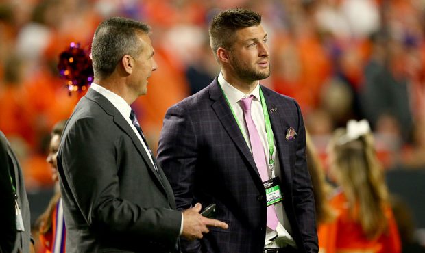 GLENDALE, AZ - JANUARY 11: Urban Meyer talks with Tim Tebow during the 2016 College Football Playof...