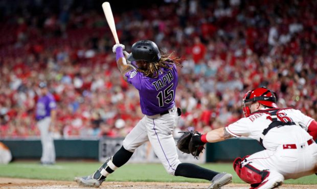 CINCINNATI, OH - JULY 26: Raimel Tapia #15 of the Colorado Rockies hits a double to right center to...