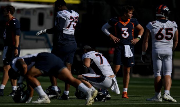 ENGLEWOOD, CO - JULY 29: Drew Lock (3) of the Denver Broncos stands with teammates during training ...