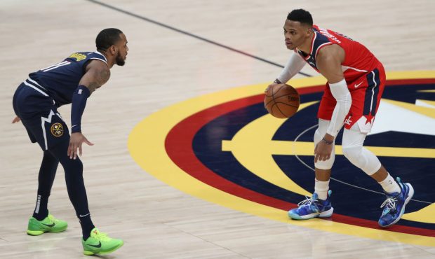 DENVER, COLORADO - FEBRUARY 25: Russell Westbrook #4 of the Washington Wizards is guarded by Monte ...