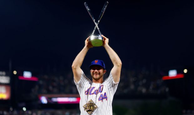 DENVER, COLORADO - JULY 12: Pete Alonso #20 of the New York Mets celebrates with the trophy after w...