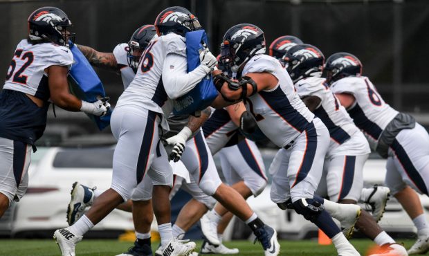 ENGLEWOOD , CO - AUGUST 3: The Denver Broncos offensive line works on drills during training camp o...