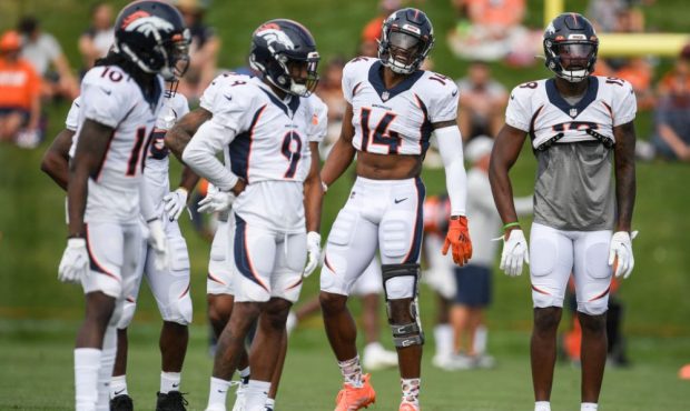 ENGLEWOOD , CO - AUGUST 3: Courtland Sutton (14) of the Denver Broncos jokes with fellow receivers ...
