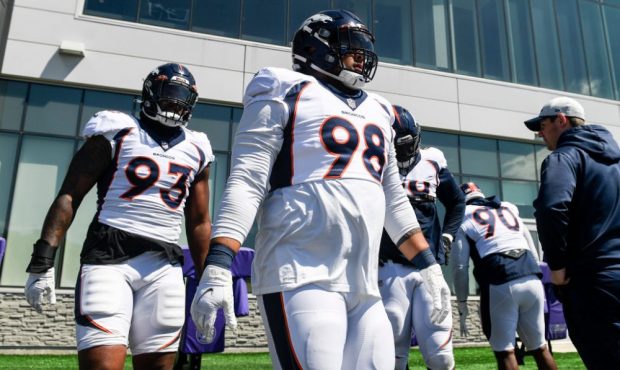 EAGAN, MN - AUGUST 11: Dre'Mont Jones (93) and Mike Purcell (98) of the Denver Broncos work out wit...