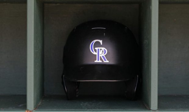 PHILADELPHIA, PA - MAY 18: A Colorado Rockies batting helmet in the dugout before a game against th...