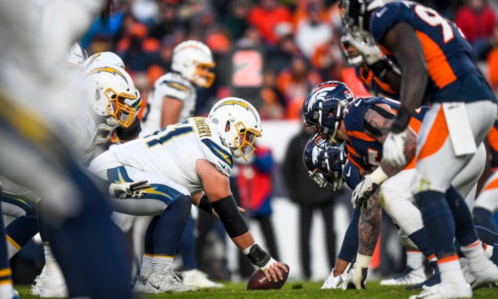 DENVER, CO - DECEMBER 1: The Los Angeles Chargers offense lines up behind Scott Quessenberry #61 in...