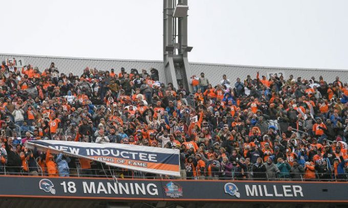DENVER, CO - OCTOBER 31: Fans reveal the name of Former Denver Broncos quarterback Peyton Manning d...