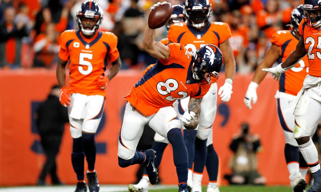 DENVER, COLORADO - NOVEMBER 28: Eric Saubert #82 of the Denver Broncos reacts after scoring a touch...