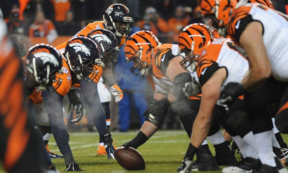 DENVER, CO - DECEMBER 28: Denver Broncos linebacker DeMarcus Ware eyes the ball at the line of scri...