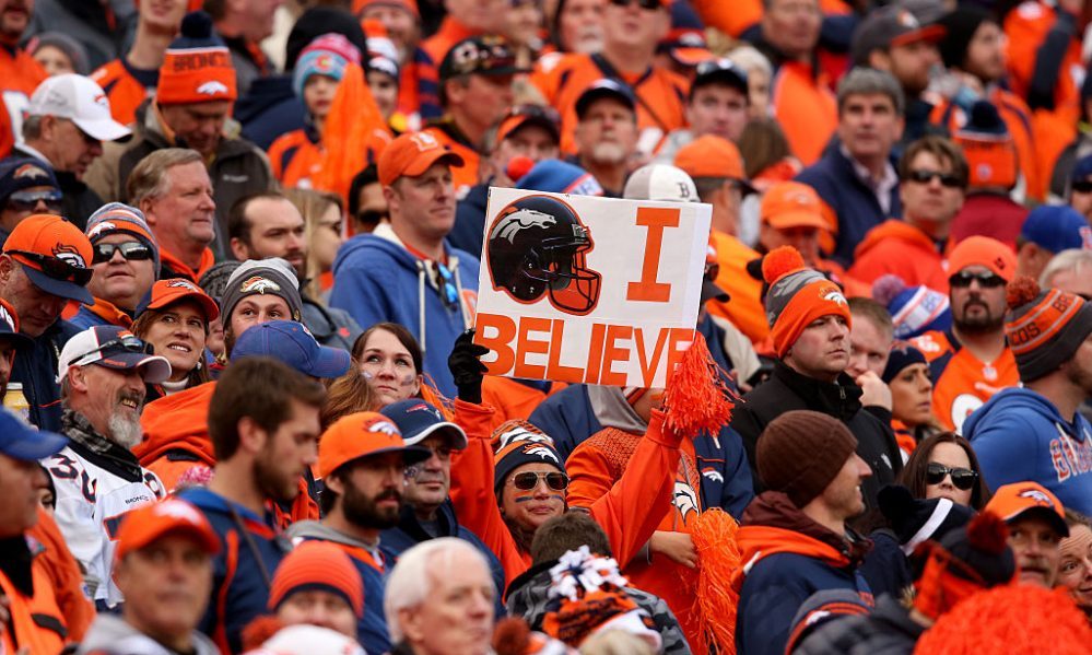 DENVER, CO - JANUARY 24: A Denver Broncos fan holds a sign in the first half of the AFC Championshi...