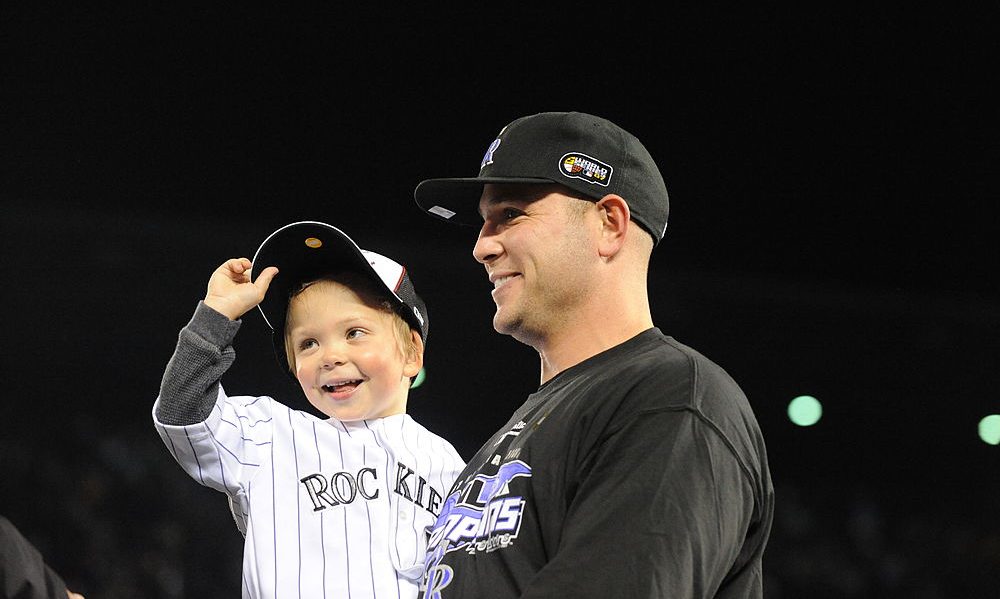 MLB - The little kid Matt Holliday is holding here was
