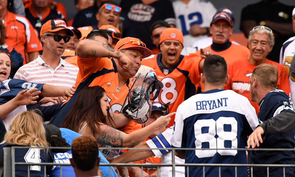 Broncos and Cowboys fans fight...
