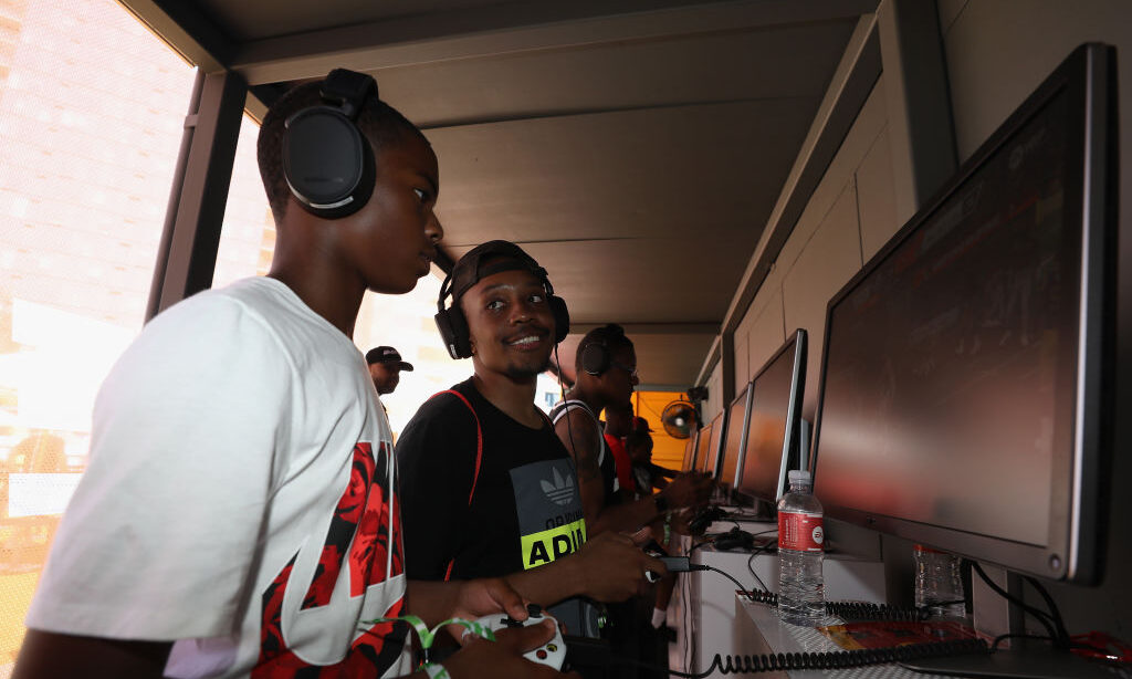 LOS ANGELES, CALIFORNIA - JUNE 08: Young game enthusiasts test "Madden 20" during the EA Play 2019 ...