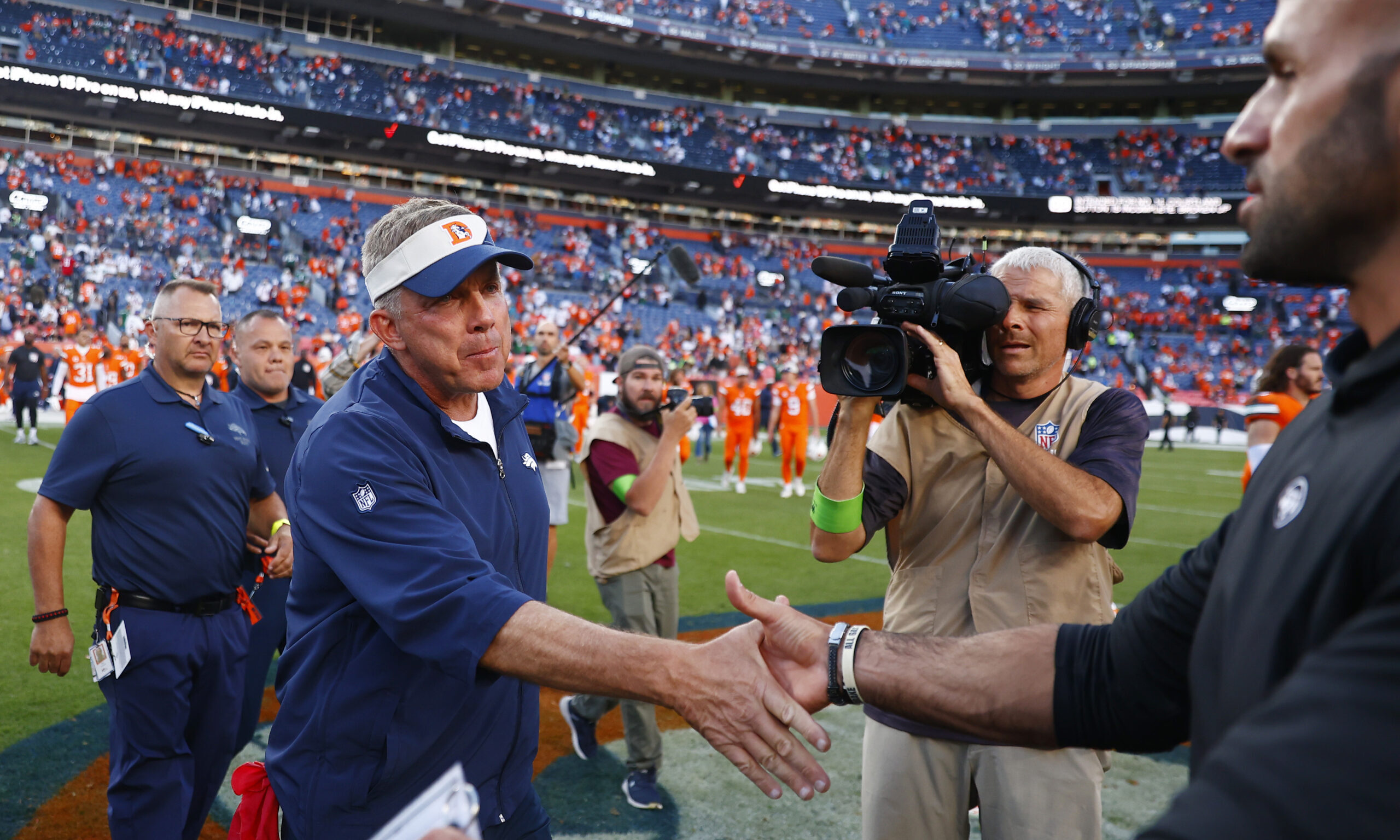 Head coach Sean Payton of the Denver Broncos and head coach Robert Saleh of the New York Jets meet...