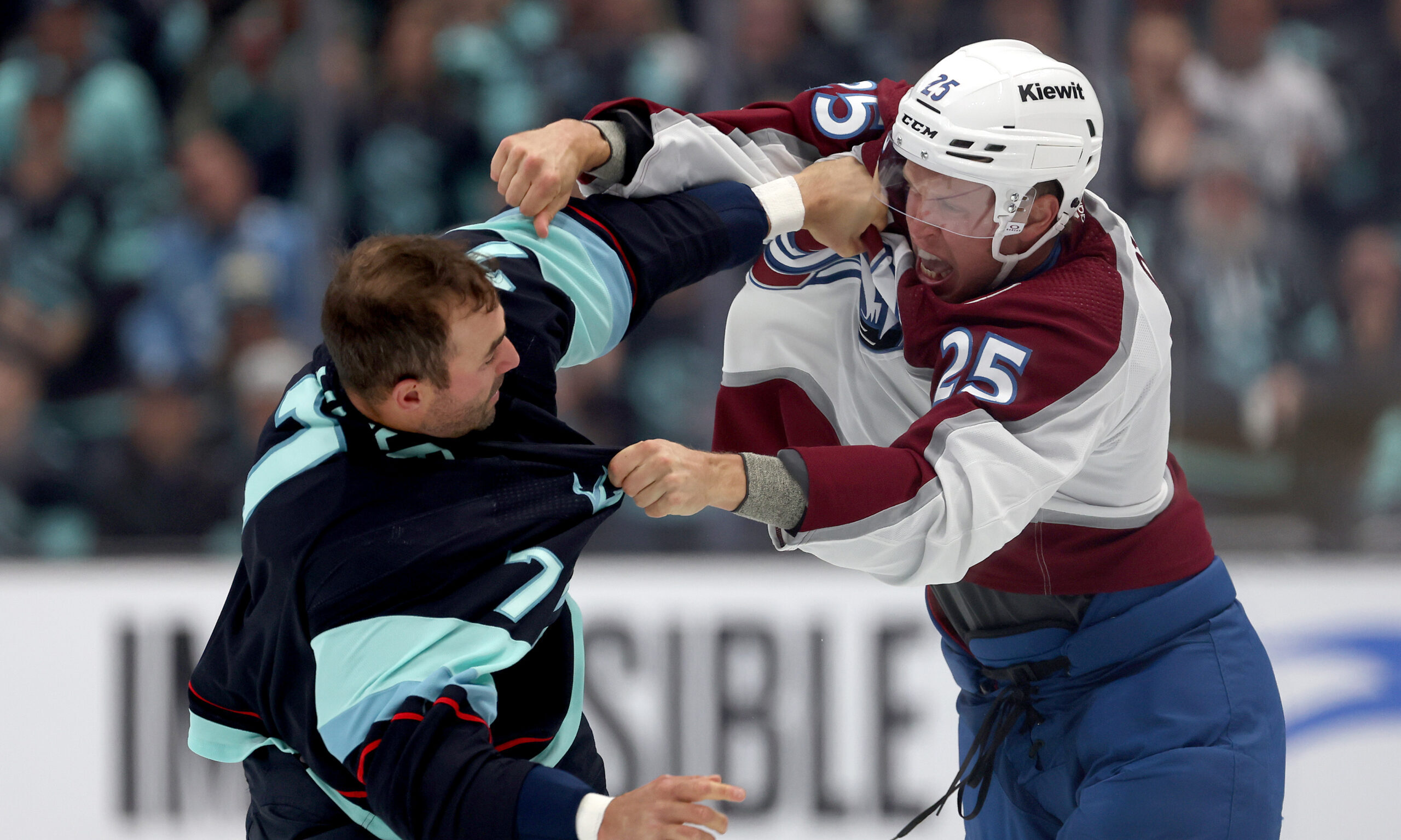 Jordan Eberle #7 of the Seattle Kraken and Logan O'Connor #25 of the Colorado Avalanche fight...