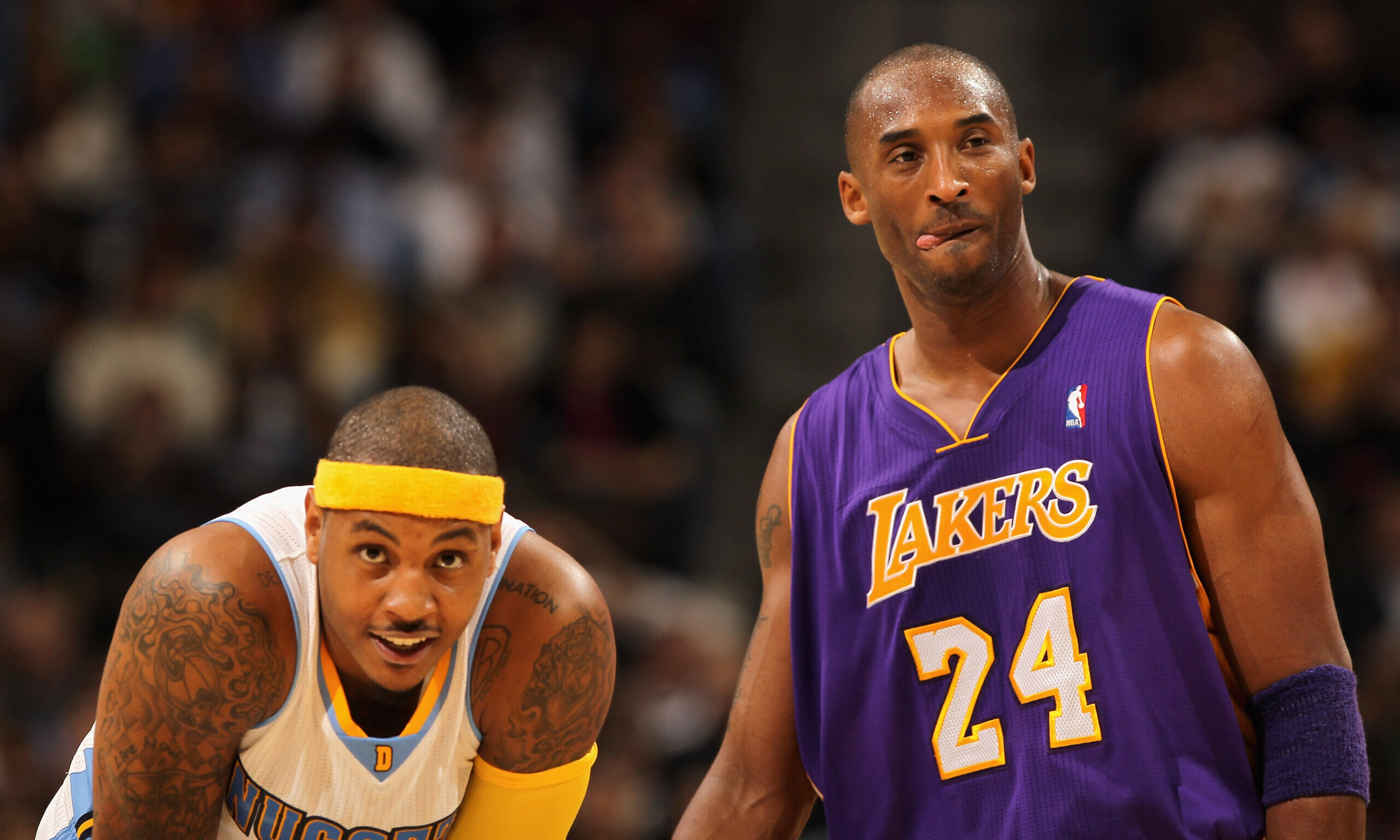 Kobe Bryant #24 of the Los Angeles Lakers and Carmelo Anthony #15 of the Denver Nuggets...