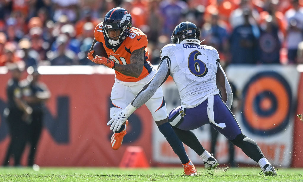 Tim Patrick #81 of the Denver Broncos is covered by Patrick Queen #6 of the Baltimore Ravens...