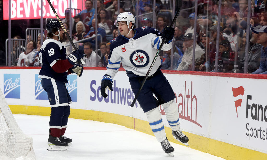 Sean Monahan #23 of the Winnipeg Jets celebrates after scoring against the Colorado Avalanche...