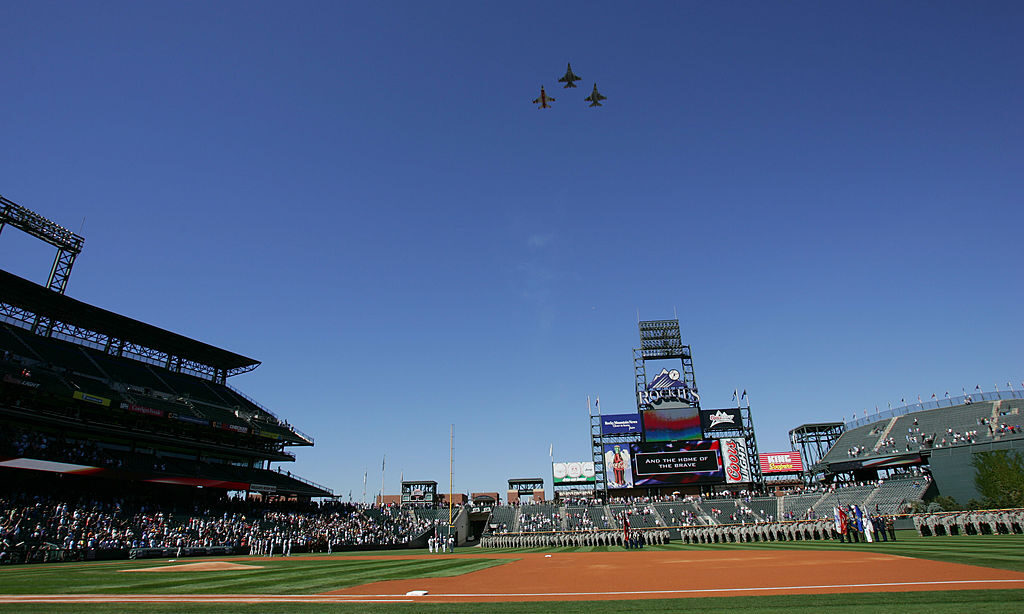 Three military aircraft fly over Coors Field during the conclusion of the National Anthem, prior to...