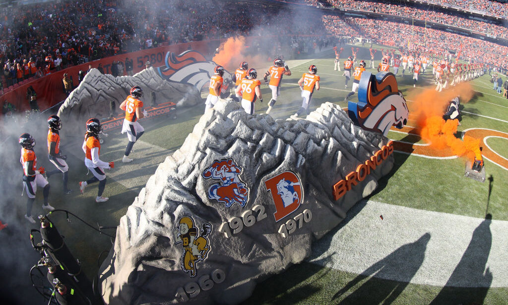 Denver Broncos players take the field...