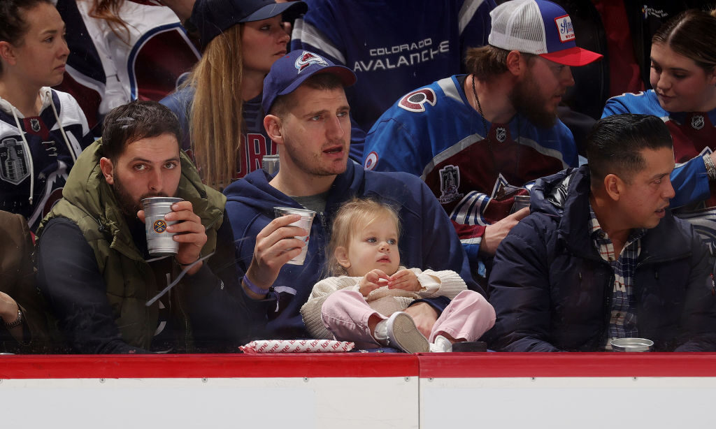 Denver Nuggets player Nikola Joki and daughter, Ognjena, watch the third period of the Colorado Ava...