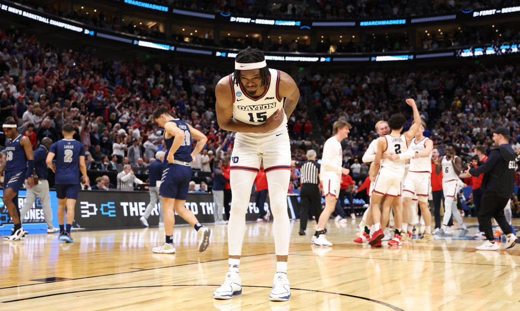 DaRon Holmes II #15 of the Dayton Flyers celebrates defeating the Nevada Wolf Pack 63-60 in the fir...