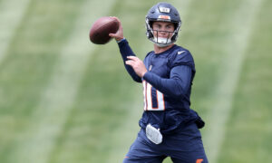 Who was the star of Denver Broncos OTAs at quarterback?