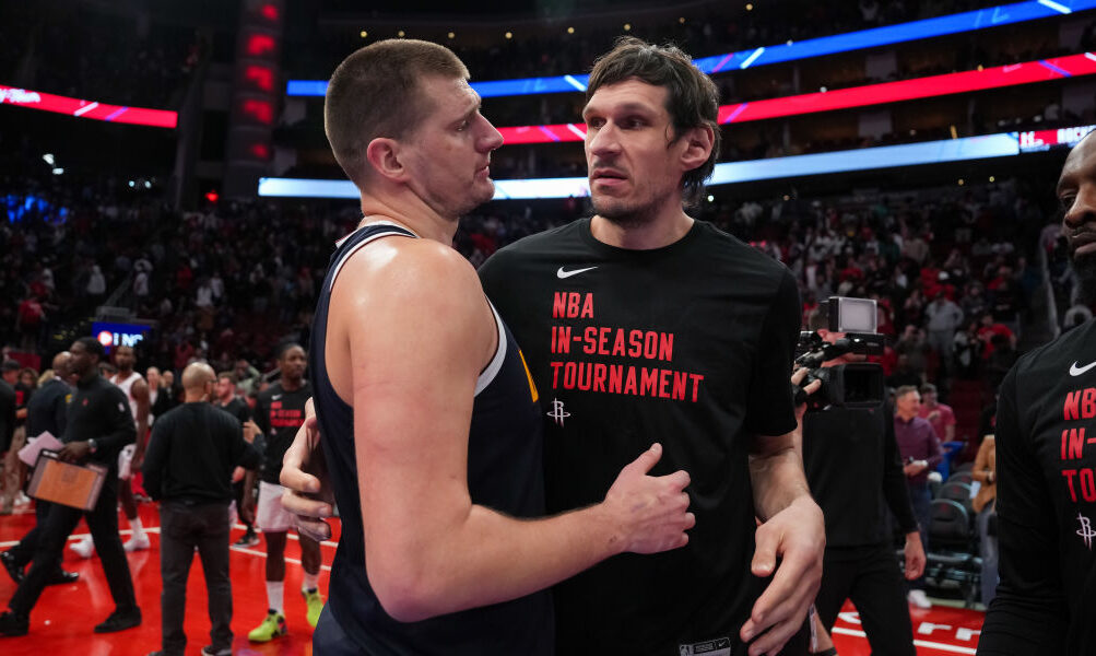 Nikola Jokic #15 of the Denver Nuggets hugs Boban Marjanovic #51 of the Houston Rockets...