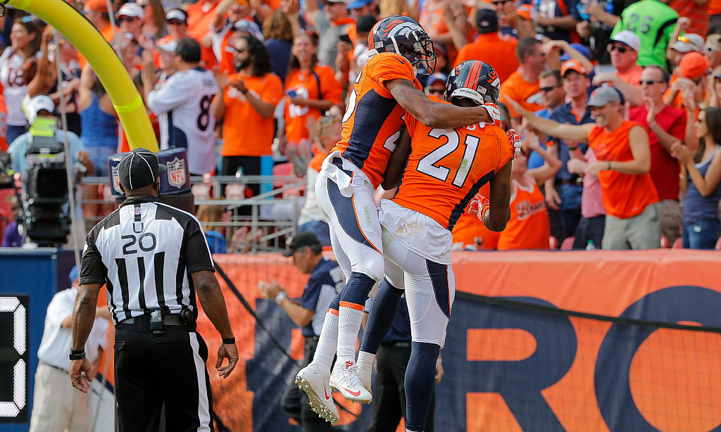 Cornerback Aqib Talib #21 of the Denver Broncos celebrates with cornerback Chris Harris #25...