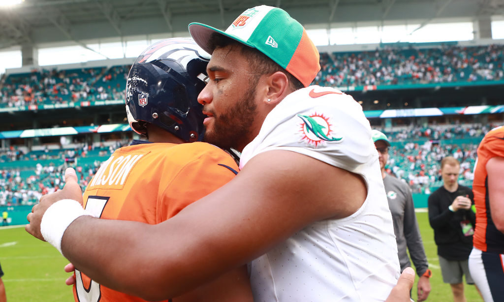 MIAMI GARDENS, FLORIDA - SEPTEMBER 24: Russell Wilson #3 of the Denver Broncos hugs Tua Tagovailoa ...