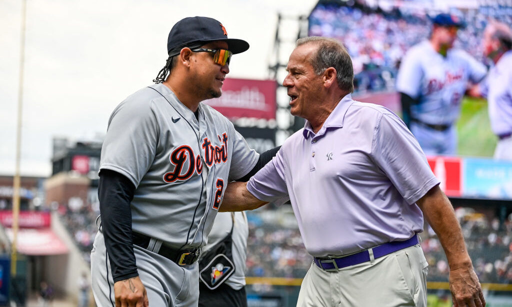 Colorado Rockies owner Dick Monfort greets Miguel Cabrera #24 of the Detroit Tigers during a pre-ga...